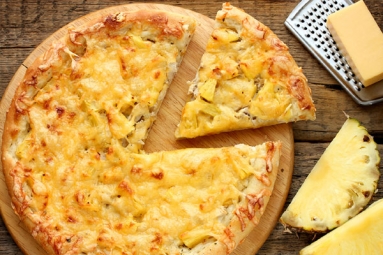 Rejoice Pizza Lovers! Domino’s Launches Pizza with Pineapple Toppings and People Has Divided Opinions