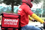 Zomato breaking updates, Zomato latest updates, zomato has half its net loss, Swiggy