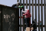 entering US via mexico, punjabis crossing mexico border, video clip shows punjabi women children crossing border fence into u s, Mexico border