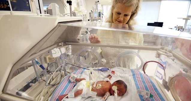 Identical 'quadruplets' born to 42-year-old woman},{Identical 'quadruplets' born to 42-year-old woman